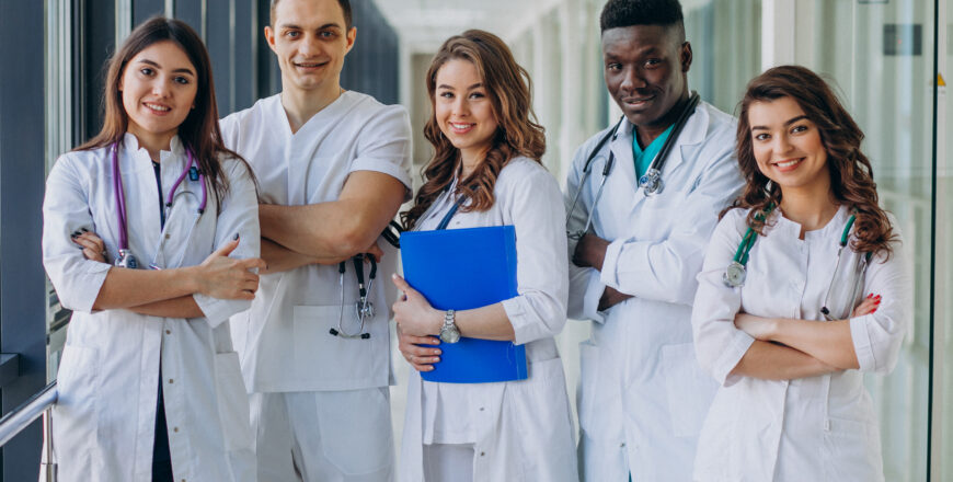 team-young-specialist-doctors-standing-corridor-hospital